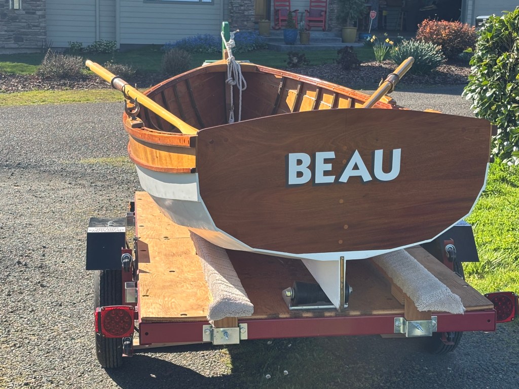 The classic Catspaw Dinghy “Beau,” a handcrafted wooden rowboat in pristine condition, ready to find a new steward while supporting Mount Union Cemetery
